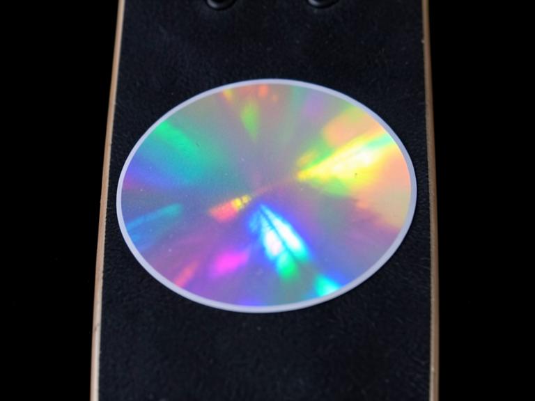 Holographic sticker on a skateboard deck